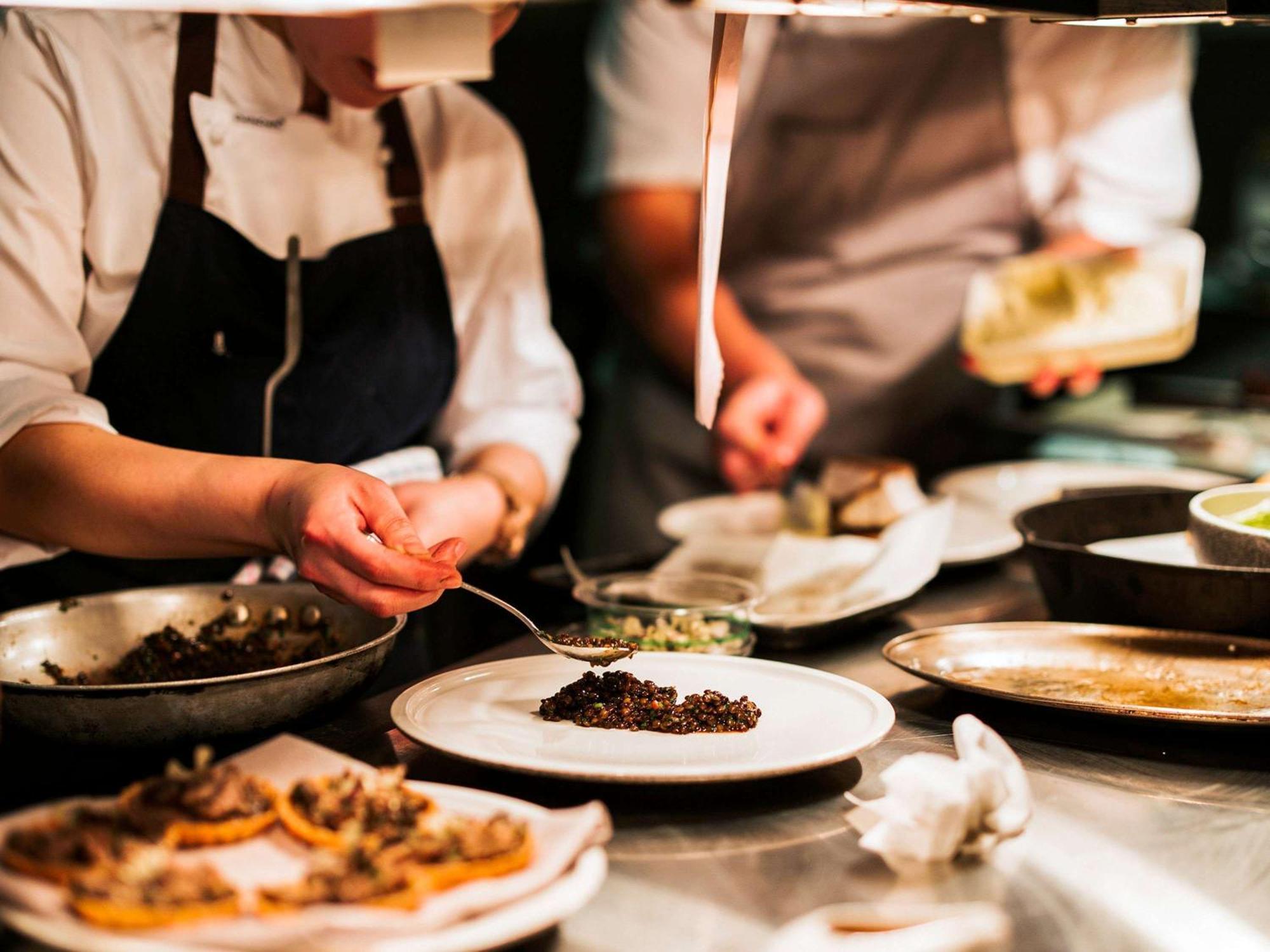 The Playford Adelaide - Mgallery Exterior foto A chef plating a dish